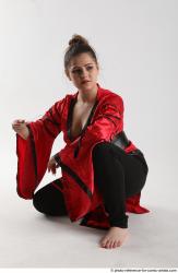 Woman Adult Average Martial art Sitting poses Coat Latino